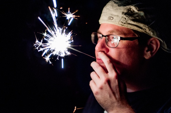 Christian Acts Like He is Smoking a Sparkler